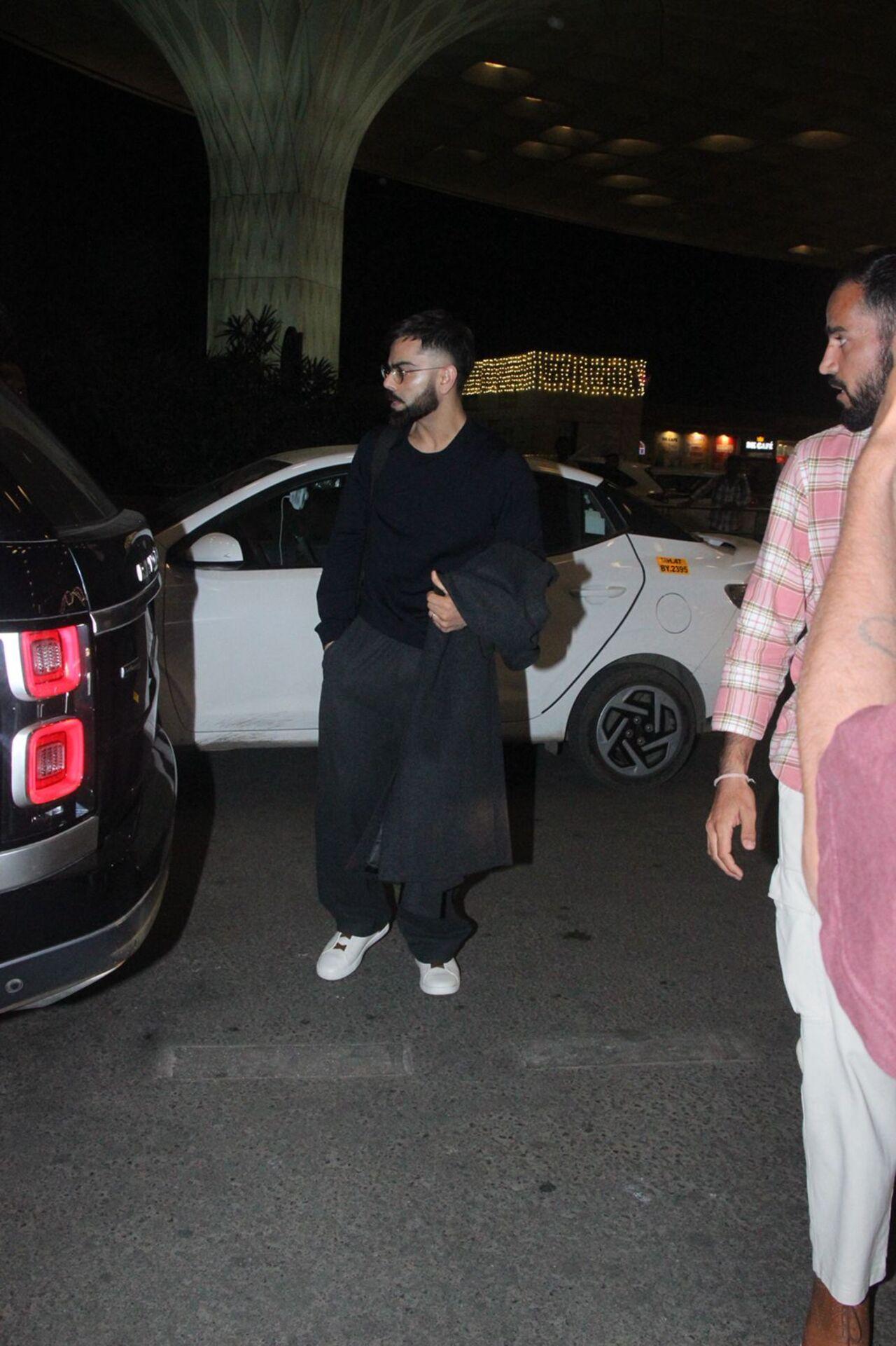 Virat Kohli made a rare appearance at the airport today in an all black outfit.
